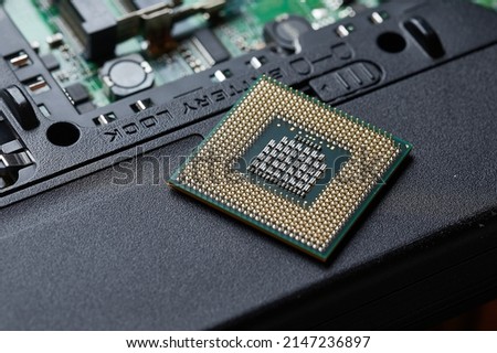 Processor cpu unit on a dissasembled laptop Royalty-Free Stock Photo #2147236897