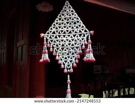 Traditional thai style flower arrangement. Mobile hang of ancient times in Thailand. thai pattern. Big garlands Flower Thai Style at Thailand.