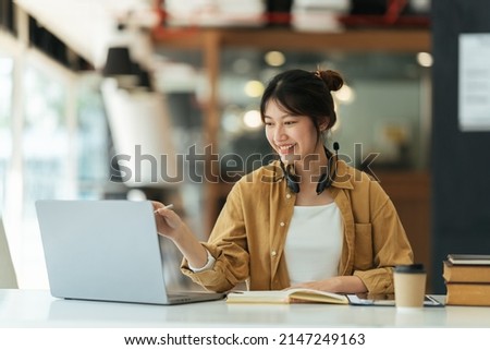 Asian girl student online learning class study online video call zoom teacher, Happy asian girl learn english language online with computer laptop. Royalty-Free Stock Photo #2147249163