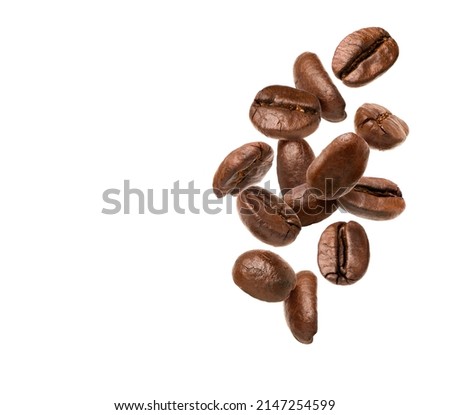 Falling coffee beans isolated on white background, Royalty-Free Stock Photo #2147254599