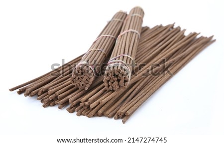 Tibetan incense sticks (red sandalwood). Isolated on white background.