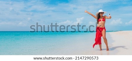 Beach vacation summer woman taking fun phone selfie photo with smartphone. Elegant Asian woman wearing sunglasses doing phone self portrait photo excited in sun on tropical travel holidays
