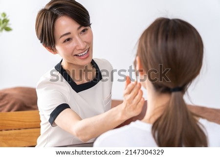 Asian women receiving courteous counseling Royalty-Free Stock Photo #2147304329