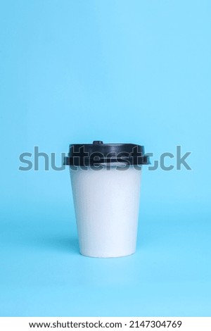 White paper cup isolated on blue background. Realistic set mock up for branding,  template for your design, presentation, promo, ad.