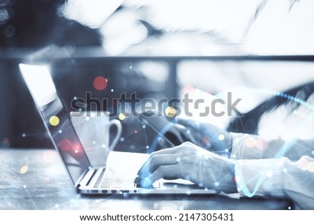 Close up of businessman hands using laptop and smartphone on blurry outdoor background with polygonal bokeh mesh. Push notification, communication and network concept. Double exposure