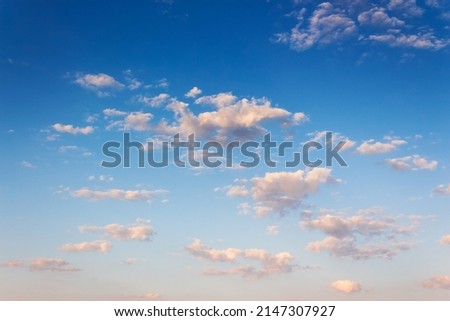 bright blue sky in the morning. clouds glowing in pink light. sunny atmosphere abstract background in summer. freedom concept