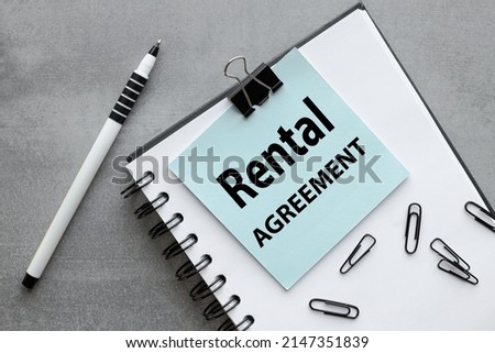 rental agreement. text on blue square sticker