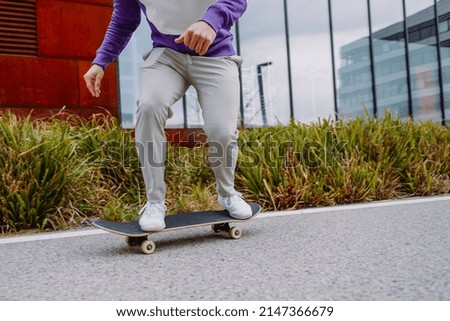 Midsection Close up leg shot of a skater with skateboard. Copy space