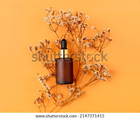 Top view of cosmetic bottle cream mockup, Blank label package on orange background.