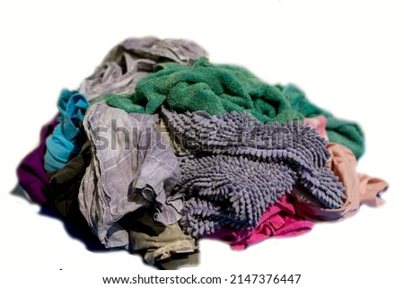 pile of old clothes, used clothes Garbage from the fabric on a white background Royalty-Free Stock Photo #2147376447