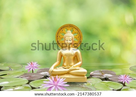 Sitting Buddha on bokeh nature background. Royalty-Free Stock Photo #2147380537