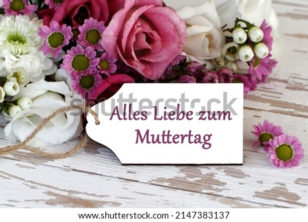 Bouquet of flowers with the text alles liebe zum Muttertag. Alles liebe zum Muttertag  means happy Mother's Day.