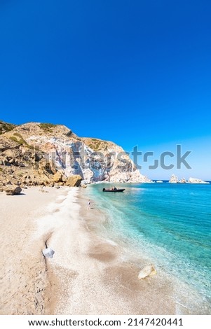 Young girl walking on idyllic beach surrounded by amazing cliffs on Greek island of Milos Royalty-Free Stock Photo #2147420441