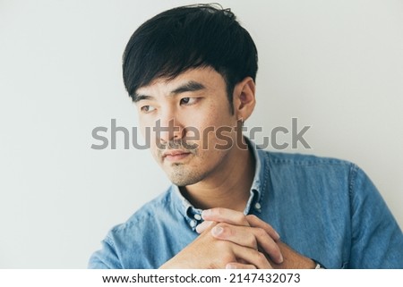 adult asian man.young male person.posing smiling thinking positive happy people.empty space for text advertising.white background.attractive fashion
