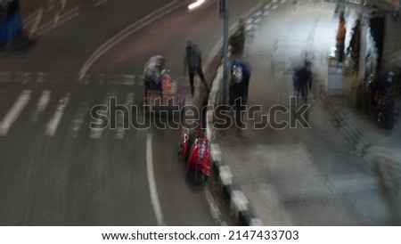 Blurred abstract: Street vendors go home.                               