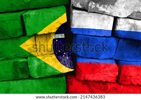 Concept of the relationship between Brazil and Russia with two painted flags on a damaged brick wall