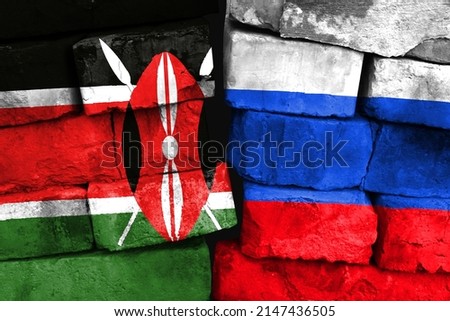 Concept of the relationship between Kenya and Russia with two painted flags on a damaged brick wall
