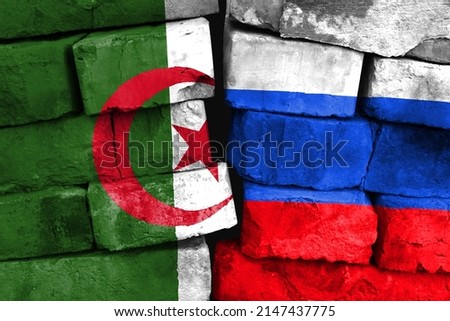 Concept of the relationship between Algeria and Russia with two painted flags on a damaged brick wall