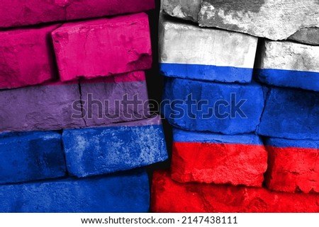 Concept of the relationship between Bisexual and Russia with two painted flags on a damaged brick wall