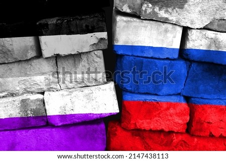 Concept of the relationship between Asexual and Russia with two painted flags on a damaged brick wall