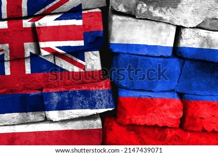 Concept of the relationship between State of Hawaii and Russia with two painted flags on a damaged brick wall