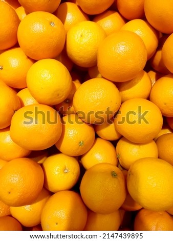  Stacks of orange fruit stacks in the supermarket.