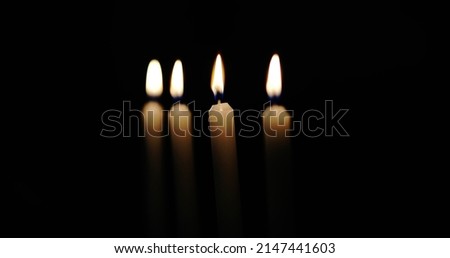 Lit Candles on black background