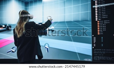 Automotive Engineer Using a VR Software to Showcase Electric Motor and Vehicle Platform in Interactive Environment. Female Engineer Using Virtual Reality Headset and Controllers for Her Project.