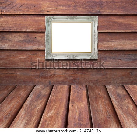 Vintage picture frame isolated on old wooden background