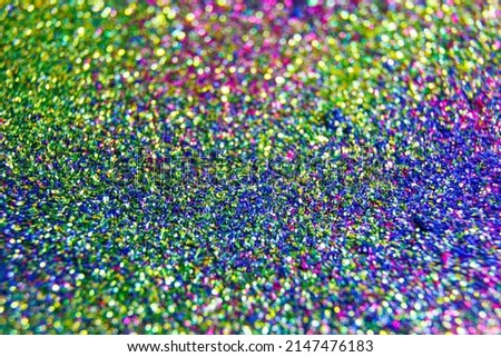 close up of a texture selective focus circular vivid purple bokeh lights. Blur in motion. Multi colored glitter becoming defocused, shining bokeh