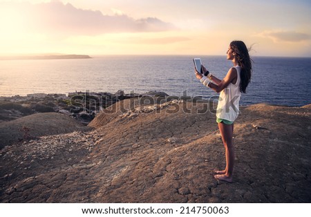 young woman who is taking a photo in an amazing place