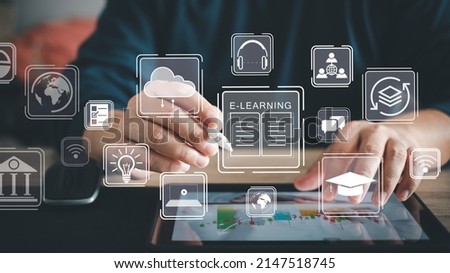 Businessman using a computer to webinar, education on internet, Online Courses e-learning concept. Learning workshop learn to think internet training knowledge technology. Graduation cap wifi icon Royalty-Free Stock Photo #2147518745
