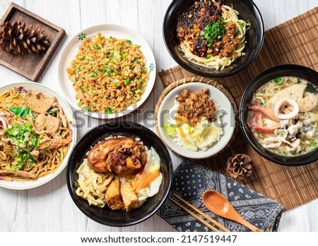 Assorted noodle soup, Pork Knuckle rice Bento, Chili Sauce Noodles, Shredded Pork Fried Rice, Dayang Chun Noodles Dry, Fried Pork Rice, in a dish isolated on wood table side view taiwan food Royalty-Free Stock Photo #2147519447