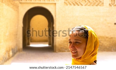 Woman walking in the Arab medina, Tozeur in Tunisia Royalty-Free Stock Photo #2147546567
