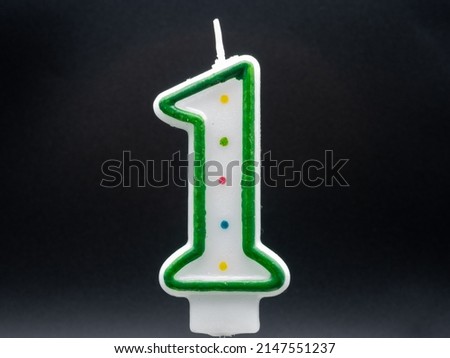 A colorful big birthday candle for a cake