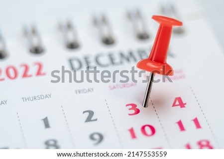 Red push pin on calendar 3th day of the month, mark the Event day with a Pin. Pin on calendar day three, date number 3. Third day of the month is marked with a red thumbtack