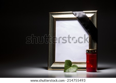 blank mourning frame with leaf and candle light