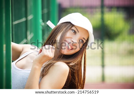 Portrait of beautiful smiling woman closeup. Girl in a white cap.