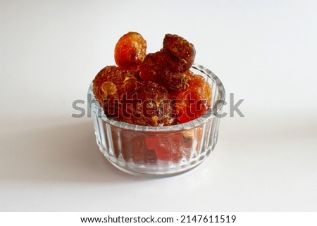 gum arabic large pieces in a glass Royalty-Free Stock Photo #2147611519