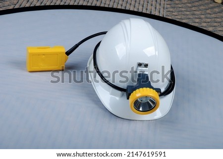 Helmet with a light above it, this helmet is specifically for mining workers who work underground as a light Royalty-Free Stock Photo #2147619591