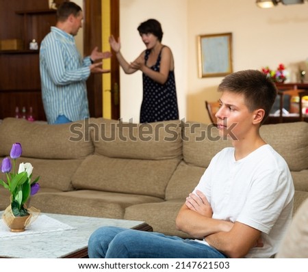 Parents quarrel with teenage son. High quality photo Royalty-Free Stock Photo #2147621503