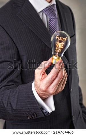 Fraud concept in a filament lightbulb.