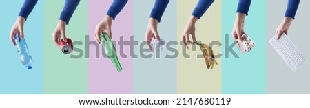 Hands holding different kinds of waste and materials, separate waste collection and recycling concept Royalty-Free Stock Photo #2147680119