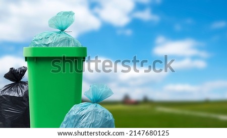 Many garbage bags and full waste bin at the park, waste management concept Royalty-Free Stock Photo #2147680125