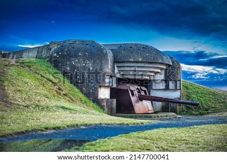 Photography of German Battery in Longues Sur Mer in Normandy. World War II Royalty-Free Stock Photo #2147700041