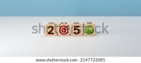 Net zero by 2050. Carbon neutral. Net zero greenhouse gas emissions target. Climate neutral long term strategy. No toxic gases. wooden cubes with net zero icon in 2050 Royalty-Free Stock Photo #2147722085