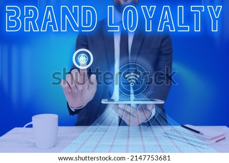 Writing displaying text Brand Loyalty. Concept meaning Repeat Purchase Ambassador Patronage Favorite Trusted Man holding Screen Of Mobile Phone Showing The Futuristic Technology. Royalty-Free Stock Photo #2147753681