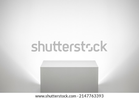 Empty white pedestal backlit in bright white studio landscape interior Royalty-Free Stock Photo #2147763393