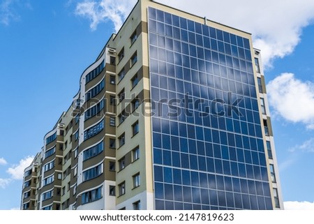 solar panels on the wall of a multi-storey building. Renewable solar energy. Royalty-Free Stock Photo #2147819623