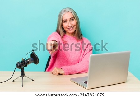 senior gray hair woman pointing at camera choosing you. influencer concept